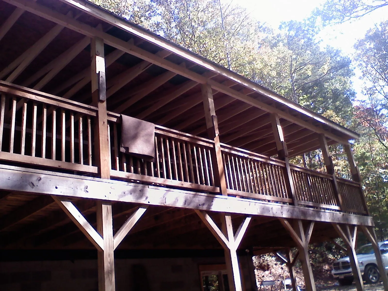 Timber framing under a new elevated porch and deck — Roof Leak Repair in Blue Point by Roofing Brothers